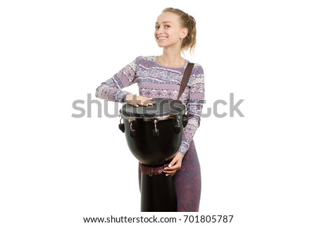 The girl plays the djembe on white background
