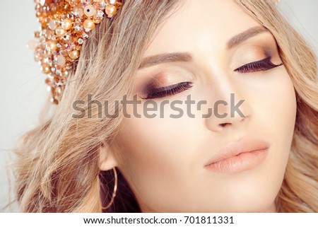 Blonde beauty. Cropped closeup Woman wearing crown, full bride bright makeup, smokey eyes closed, natural color lips. Picture for beauty magazines, journals isolated white gray background