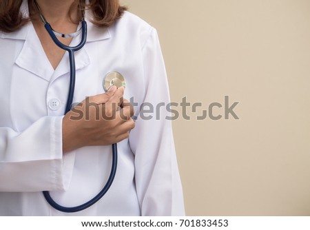 Doctor using stethoscope, listen to the beating of his own heart,Concept, doctor worked as take care of their own health. 