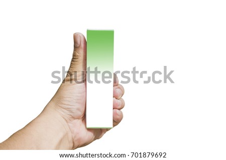 Man hand holding cream box isolated on white background.