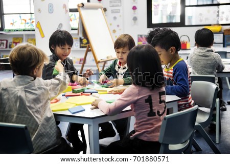 Group of diverse students at daycare Royalty-Free Stock Photo #701880571