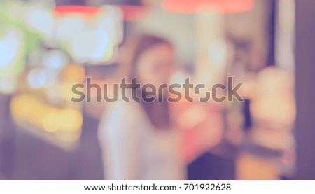 Abstract blur image of coffee shop or restaurant on day time with bokeh  for background usage. (vintage tone)