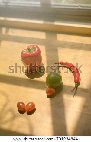 Colorful of fresh fruits and vegetable on wooden table.chili, lime, tomatoes, Cabbage, kiwi, , multi healthy fruits on background. Royalty high quality free stock image.