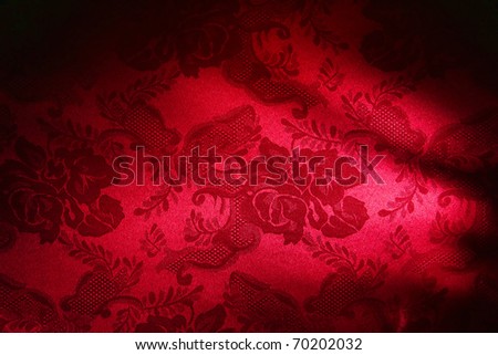 Red damask fabric with weaving floral pattern background