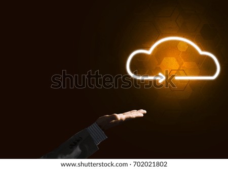 Businessman hand pointing to the luminous cloud computer concept
