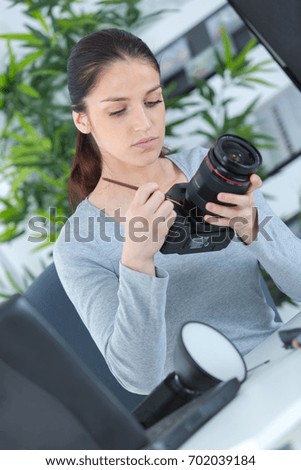 reflex camera over 100 white background