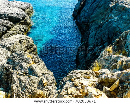 View of the Cretan wild sea coastline from the beach