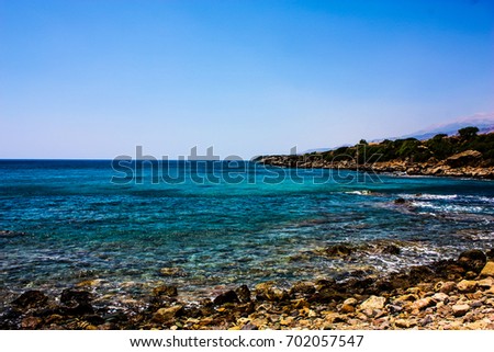 View of the Cretan wild sea coastline from the beach