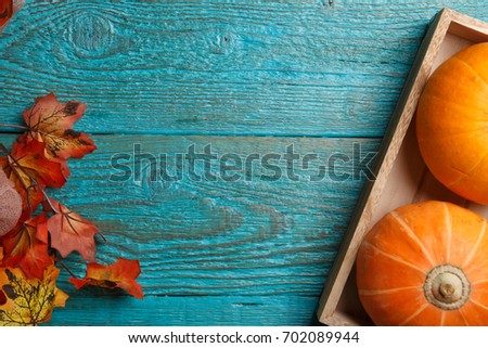 Wooden table with pumpkin, maple