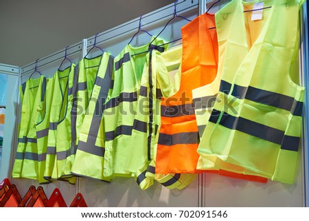 Colored, reflective vests for drivers and road workers