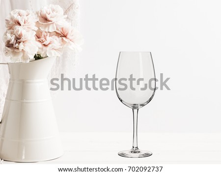 Floral mock-up of 1 wine glass next to a vase of flowers, perfect for businesses who sell decals, vinyl stickers, just overlay your design