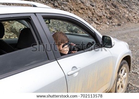 Woman photographed from the car