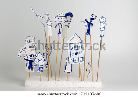 Cartoons characters and houses made from paper for shadow play isolated on white background.