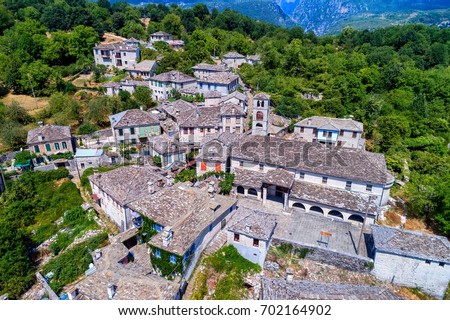 aerial view of old stone houses in the village Dilofo of Zagorochoria, Epirus, Western Greece Royalty-Free Stock Photo #702164902