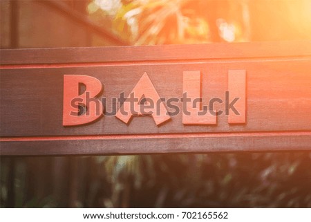 The inscription of Bali on a wooden board.