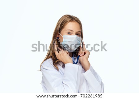 Woman doctor holding a syringe in hands
