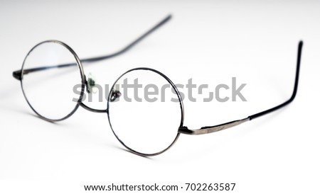 Vintage Circle Shaped Eyeglasses Over White Background