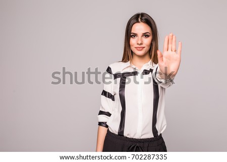 Lady making stop gesture with her palm,