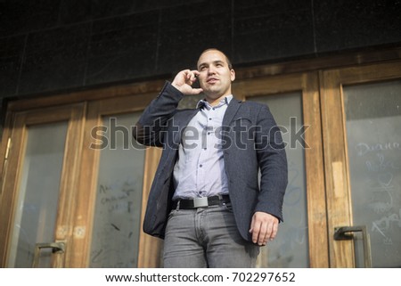 Businessman arranges by phone