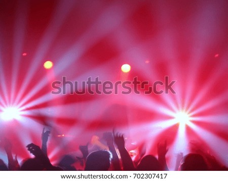 Concert crowd with lighting effects.  