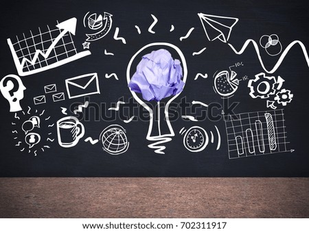Digital composite of light bulb with crumpled paper ball in front of blackboard