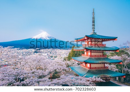 Red Pagoda with Mt Fuji on the background,Mt. Fuji with red pagoda in autumn, Fujiyoshida, Japan,Chureito Pagoda. Royalty-Free Stock Photo #702328603