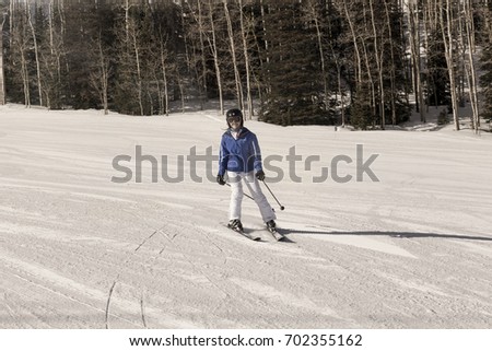 Woman skiing on mountain ski resort