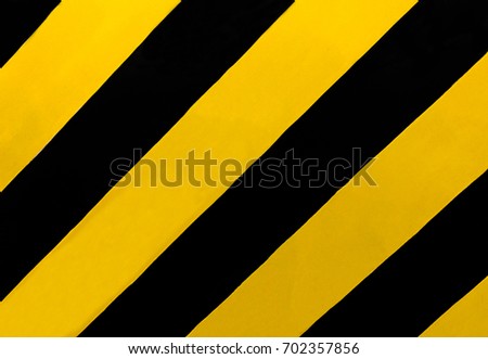 Traffic Sign: A rectangular sign with diagonal yellow and black stripes, wherever there is a median or other obstruction. Drive in the direction of the slope of the stripes to avoid the obstructions.