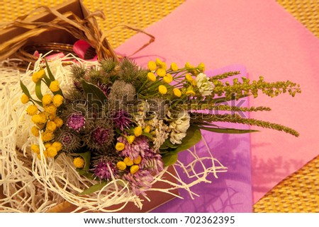 An interesting background in Boho style, with a bouquet of field herbs. Selective focus, sometimes the blur effect.