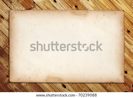 old note paper on wood background