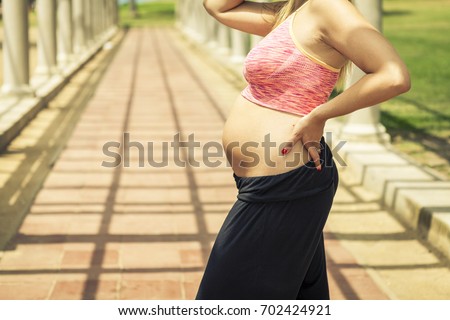 Pregnant blond woman in California