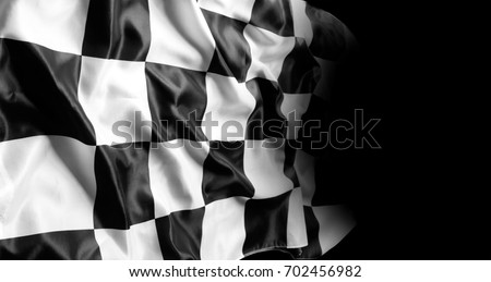 Checkered racing flag on black Royalty-Free Stock Photo #702456982