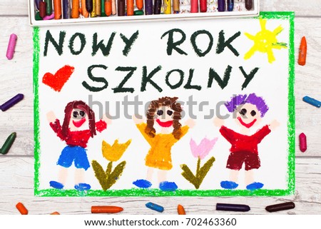 Photo of  colorful drawing: Polish words NEW SCHOOL YEAR and happy children. First day at school. 