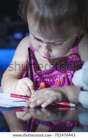 Great artist. Child girl drawing using colored pencils. Art, creative, talent, education,  happy childhood concept.