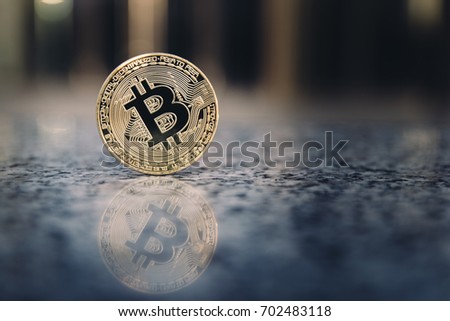 golden bitcoin on marble background