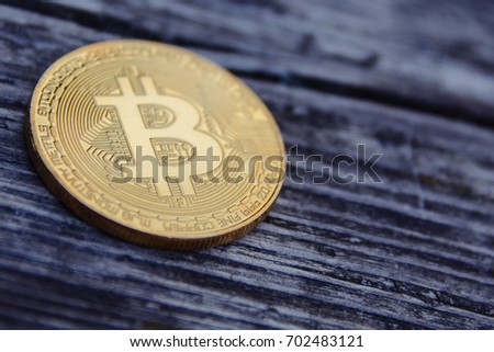 golden bitcoin on wooden background
