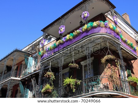 Typical French Quarter wrought iron balconies in preparation for Mardi Gras