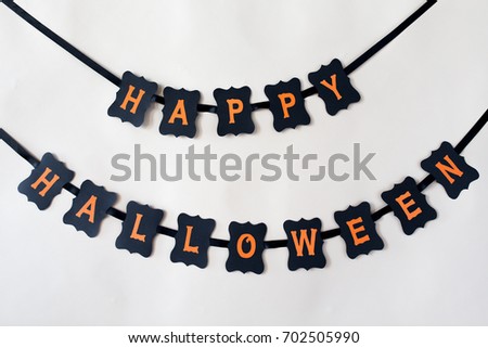holidays, decoration and party concept - happy halloween festive paper black garland or banner over white background