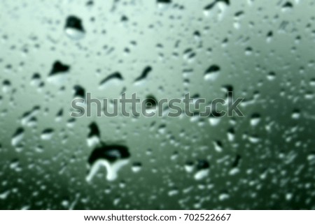 Blur water drop on car glass