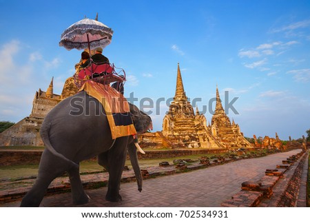 Elephant with Tourist at Wat Phra Si Sanphet temple in Ayutthaya Historical Park, a UNESCO world heritage site, Thailand