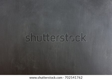 Blackboard with space to add text or graphic design.
Chalk stains on blackboard. 
education of school concept.
