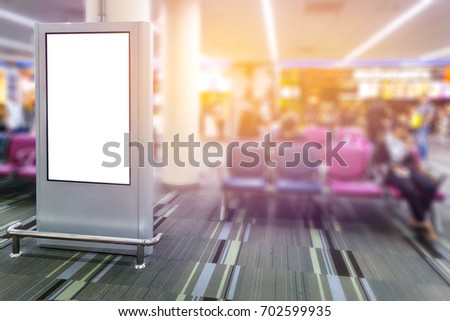 Blank mock up light box template vertical sign stand display in Airport, Advertising banner