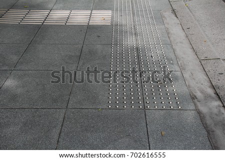 Guide block of a sidewalk