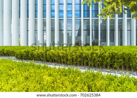 beautiful green meadow near Modern building exterior
