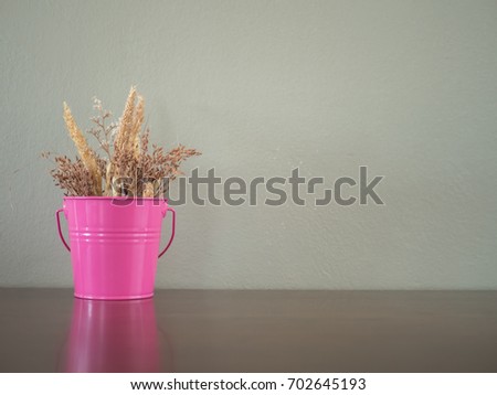 Flowers in a pink vase.