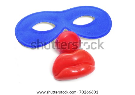 carnival mask and clown nose on a white background