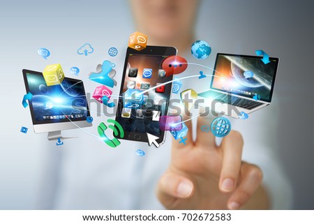 Tech devices connected to each other by businesswoman on blurred background 3D rendering