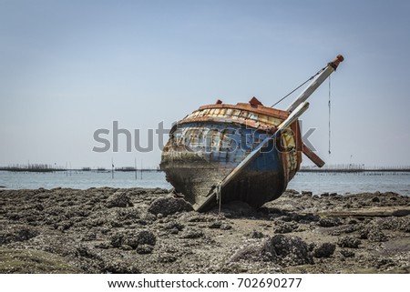 Boat crashes in the sea,Thailand. / An old shipwreck on beach. / Shipwreck in Ang Sila, Chonburi, Thailand.
 Royalty-Free Stock Photo #702690277