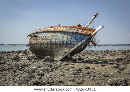 Boat crashes in the sea,Thailand. / An old shipwreck on beach. / Shipwreck in Ang Sila, Chonburi, Thailand.
 Royalty-Free Stock Photo #702690331