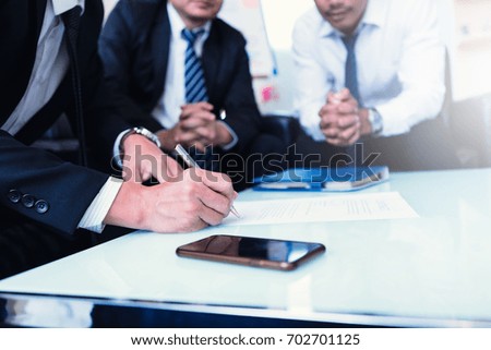 business team working on negotiation to money return on investment from business 
